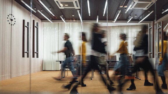 people walking through corridor